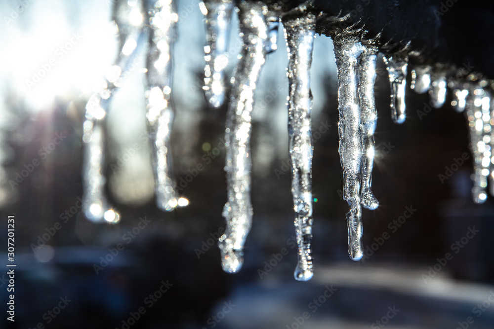 Icicles in the parking lot, cold, sunny Icicles in the parking lot, cold, sunny
