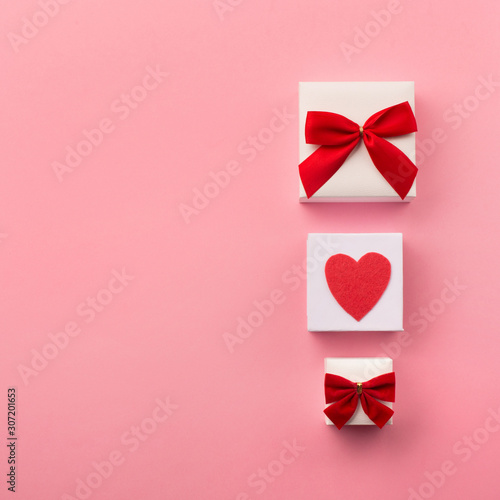 Valentines gift boxes, red bow and felt hearts