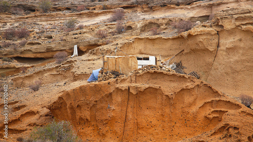 Valokuva On a rock face tent and meager dwelling of dropouts made from rubbish, Tenerife,