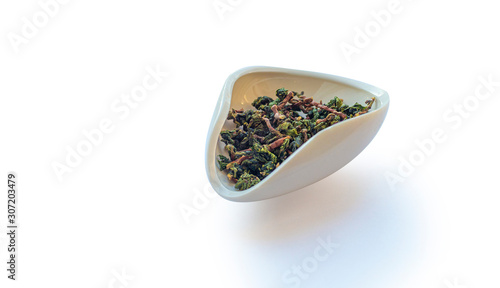 Te Guan Yin mao cha Green Tea, Oolong tea from cuts in the cha he isolated on a white background photo