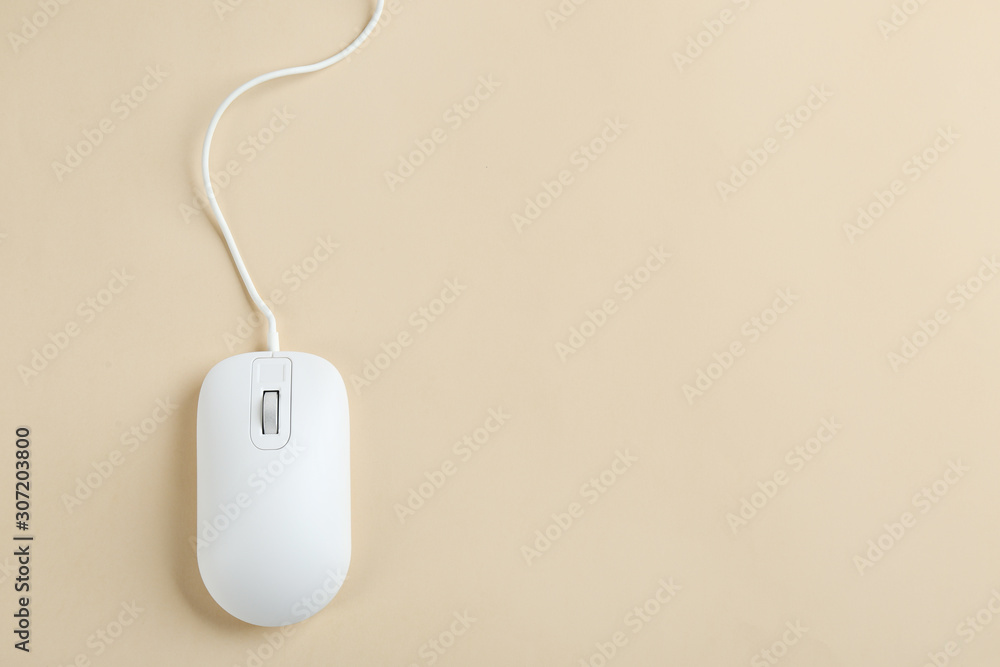 Modern wired optical mouse on beige background, top view. Space for text Modern wired optical mouse on beige background, top view. Space for text