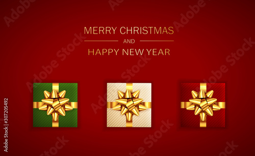 Christmas Lettering and Gifts with Golden Holiday Bow on Red Background