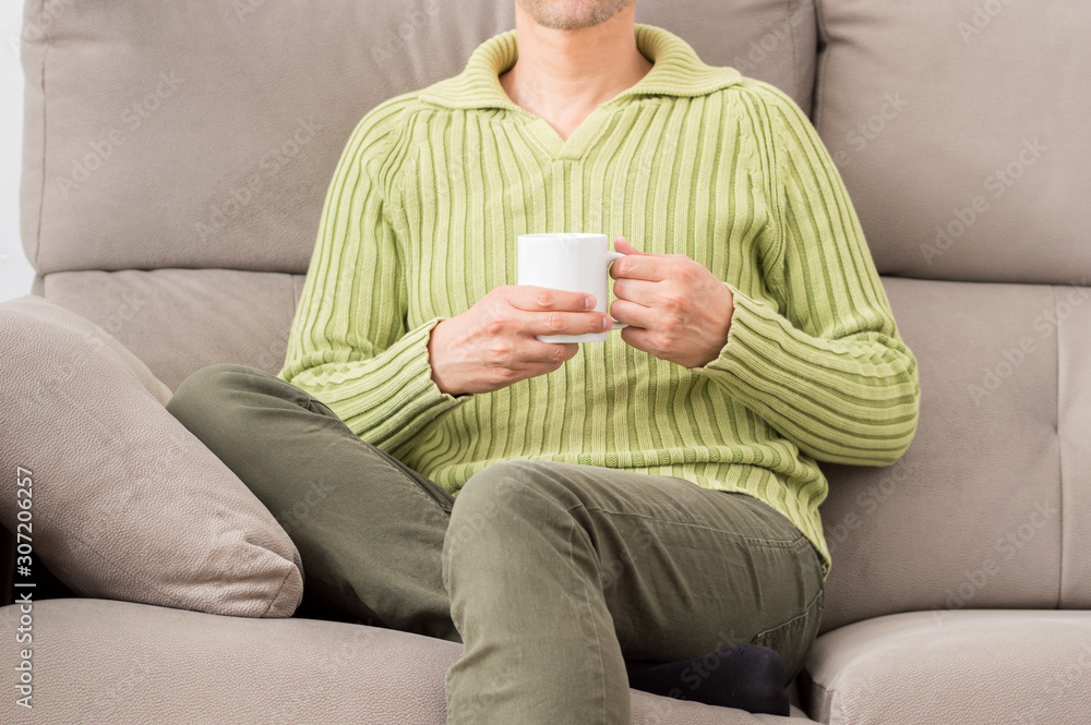 man holding a cup of coffee in winter man holding a cup of coffee in winter