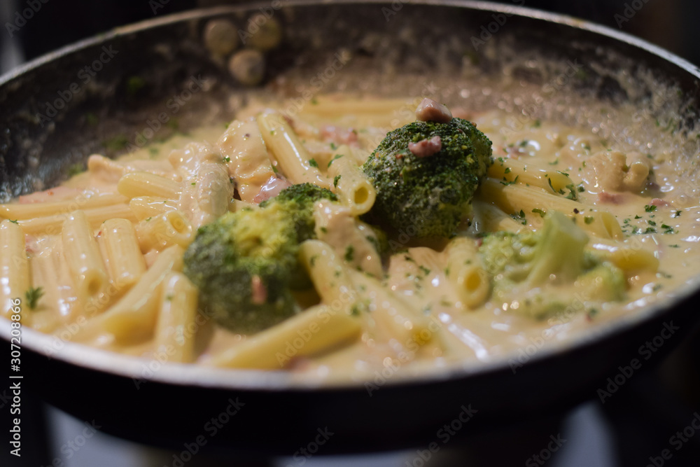Hot brocolli penne pasta in the pan Hot brocolli penne pasta in the pan