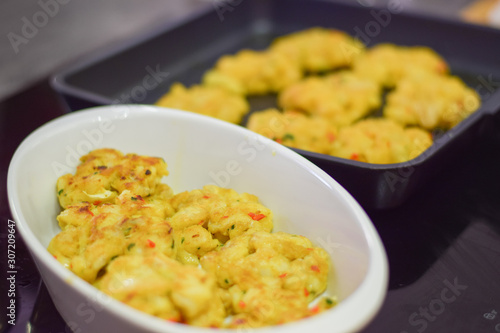 Fish cakes in the dish and frying fan