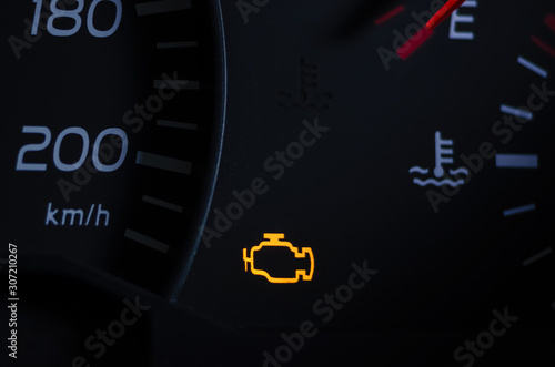 Obraz na płótnie Yellow lit engine error sign on car dashboard close up w salonie