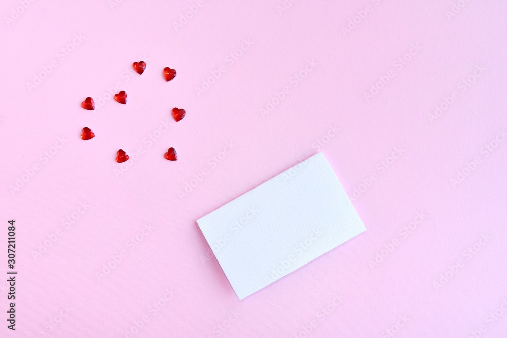 Elegant greeting card with empty space for text on pink paper background with red decorative hearts. Valentines Day romantic card. Empty card in a romantic style for woman on birthday or Mother’s Day Elegant greeting card with empty space for text on pink paper background with red decorative hearts. Valentines Day romantic card. Empty card in a romantic style for woman on birthday or Mother’s Day