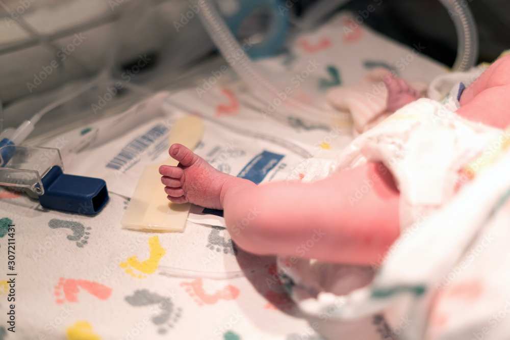 Newborn Baby Foot in Hospital Bed - select focus Newborn Baby Foot in Hospital Bed - select focus