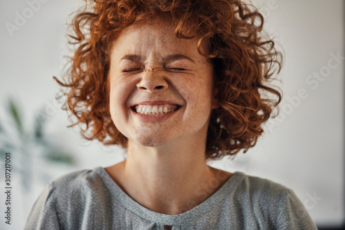 Portrait of a happy woman with closed eyes photo