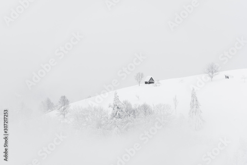 Fantastic landscape with snowy house © Ivan Kmit