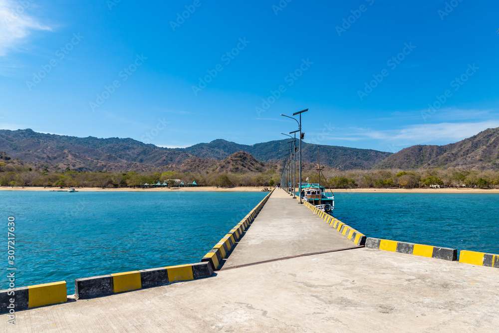 View from long tourist boat pier at the entrance of the Komodo National Park, Indonesia View from long tourist boat pier at the entrance of the Komodo National Park, Indonesia
