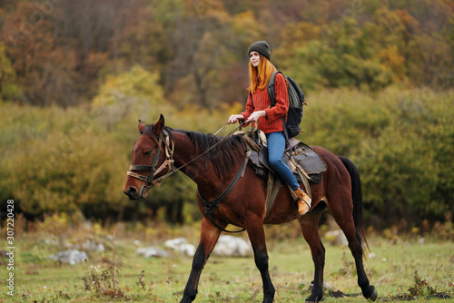 young woman riding a horse © SHOTPRIME STUDIO