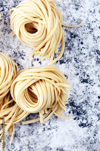 Closeup of raw homemade pasta. fresh italian traditional raw fresh pasta