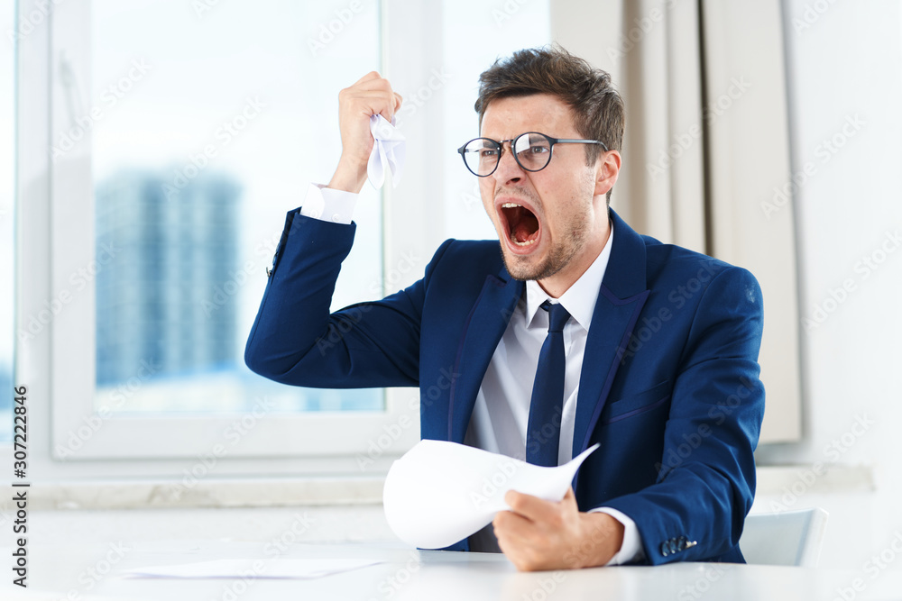 portrait of a businessman working in his office portrait of a businessman working in his office
