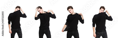 Young male model in black clothes posing in studio white background. Caucasian guy in stylish clothes sweater and jeans isolate. Fashion model young white man