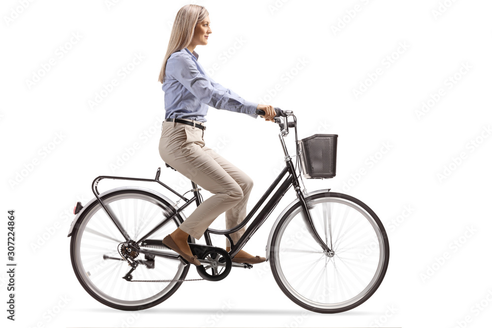 Young woman in formal clothes riding a bicycle Young woman in formal clothes riding a bicycle
