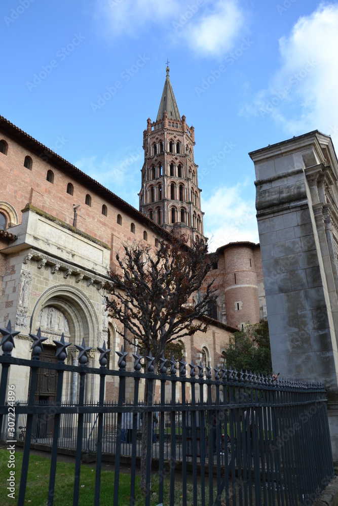 south entrance portal (Miejeville gate) and openwork bell tower of the Basilica of Saint-Sernin in Toulouse