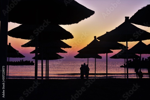 people watching the sunrise on the seashore © sebi_2569