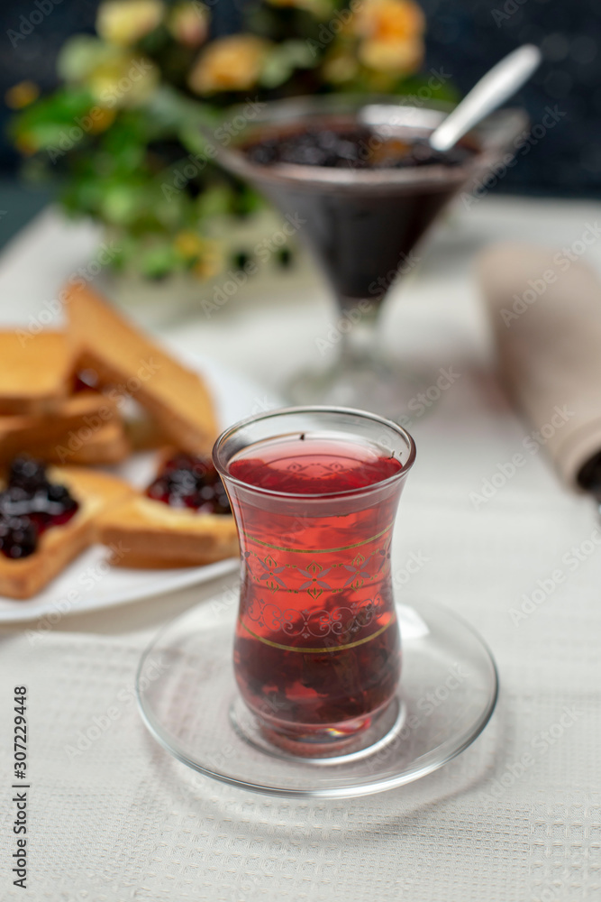 tasty blackberry jam, tea and toast on the table tasty blackberry jam, tea and toast on the table
