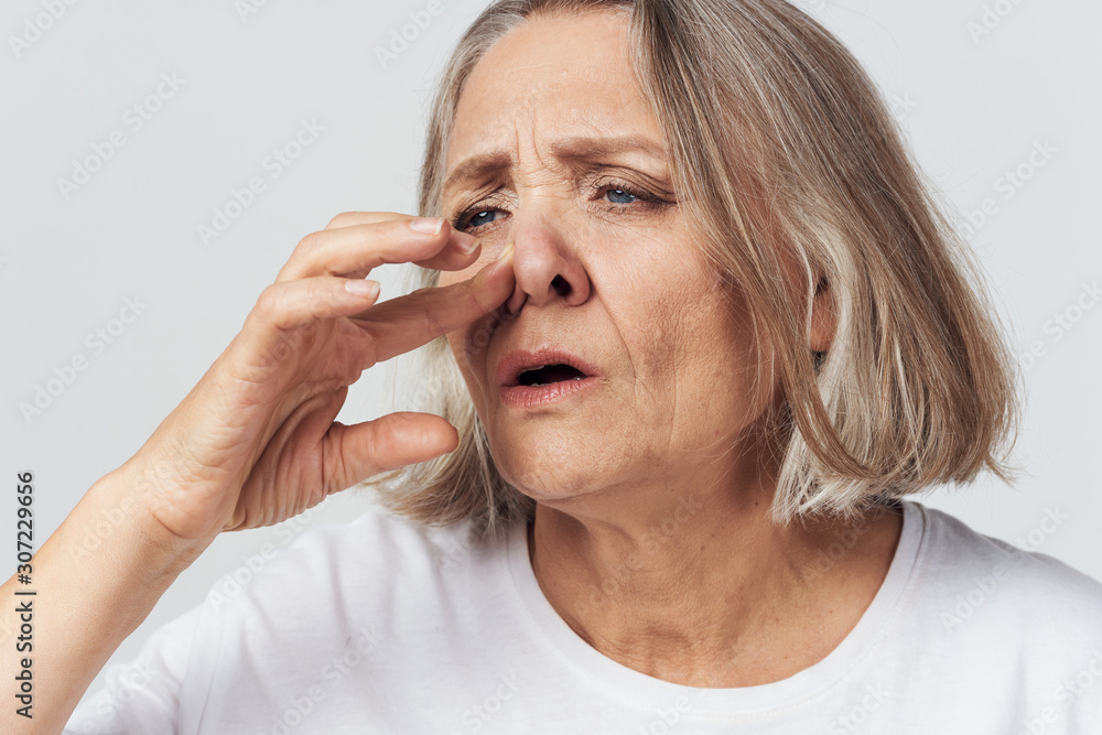 portrait of senior woman with headache portrait of senior woman with headache