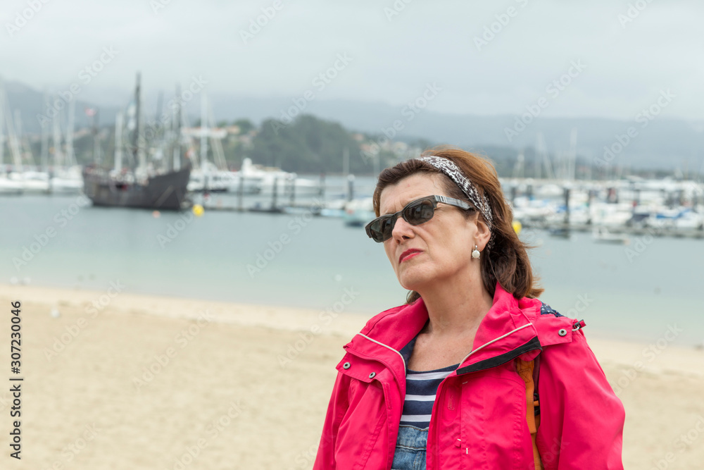 tourist in Baiona, behind the caravel of Colon, Galicia, Spain