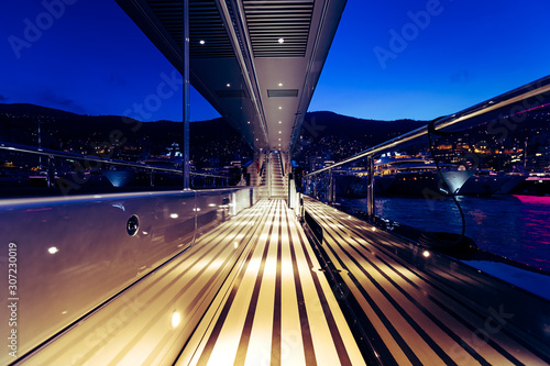 Beautiful shot of a night view full of lights and adventure from a private yacht © SPIX PRODUCTION
