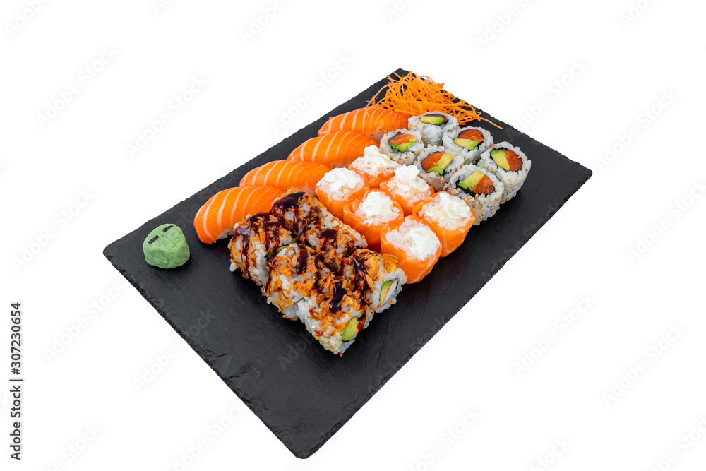 High angle shot of tasty delicious sushi rolls on a black surface High angle shot of tasty delicious sushi rolls on a black surface