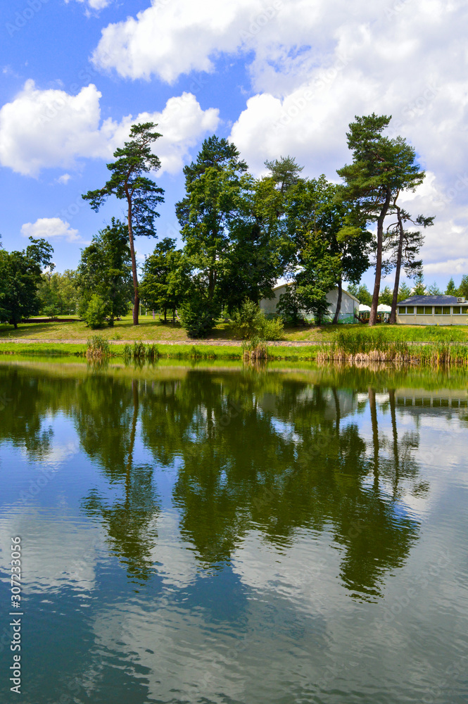 Obraz premium The lake in Feofania park, sunny summer landscape in Kyiv, Ukraine on July 15, 2018.