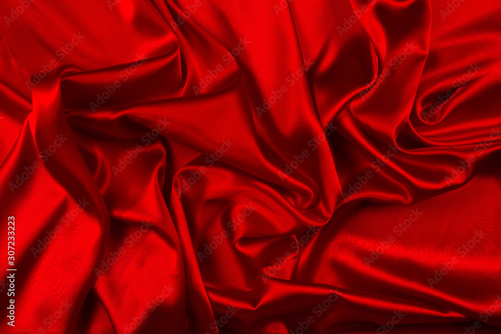 Red silk or satin luxury fabric texture can use as abstract background. Top view. Red silk or satin luxury fabric texture can use as abstract background. Top view.