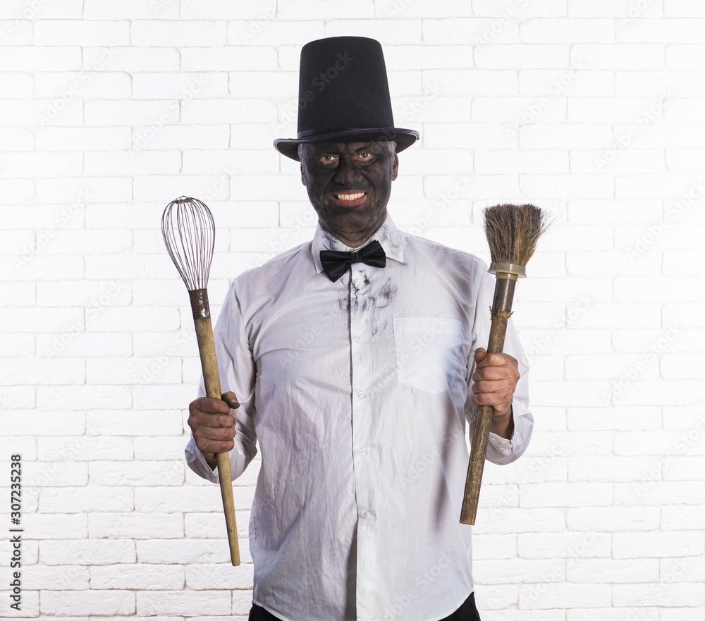 portrait of a chimney sweep in soot, a brush for cleaning chimneys portrait of a chimney sweep in soot, a brush for cleaning chimneys