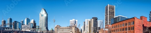 Panoramic view of a Montreal downtown with blue sky