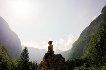 Woman on Top of Rock
