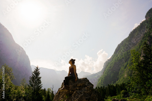 Woman on Top of Rock photo