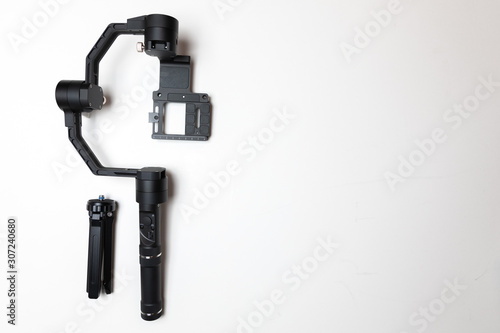 DSLR camera gimbal three-axis motorized stabilizer Tripod System on a white background, isolated