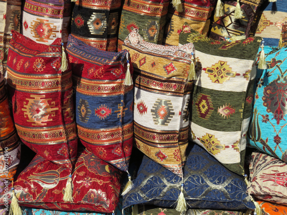 Colorful pillows on street market 