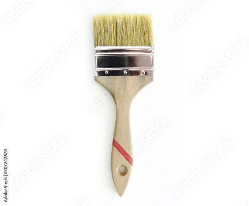 Wallpaper Mural Isolated paint brush. Thick handle with longer bristles of double thickness and natural color . White background Torontodigital.ca