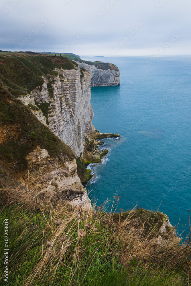 Panoramatic view on Etretat steep rock coastal cliffs at north of France, served as many inspiration for Monet, the impresionist painter
