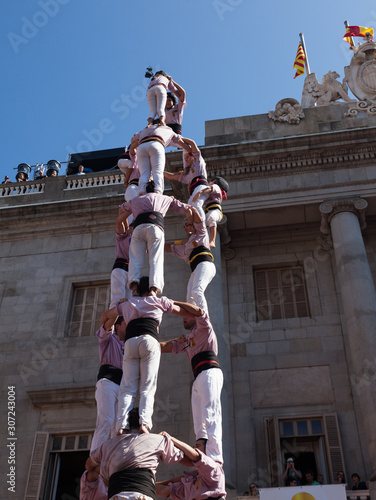 Castellers make castell in front of the ayuntamiento building  in Barcelona