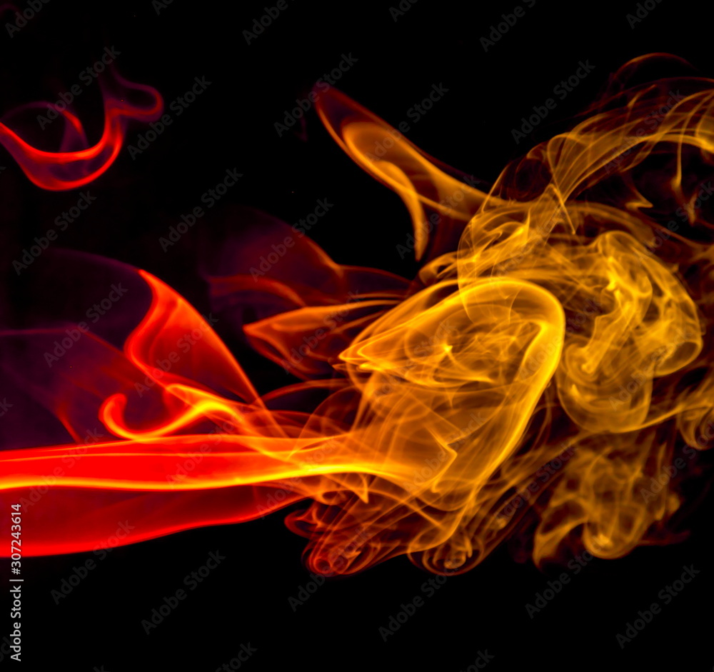 Fototapeta premium Colored smoke on black background