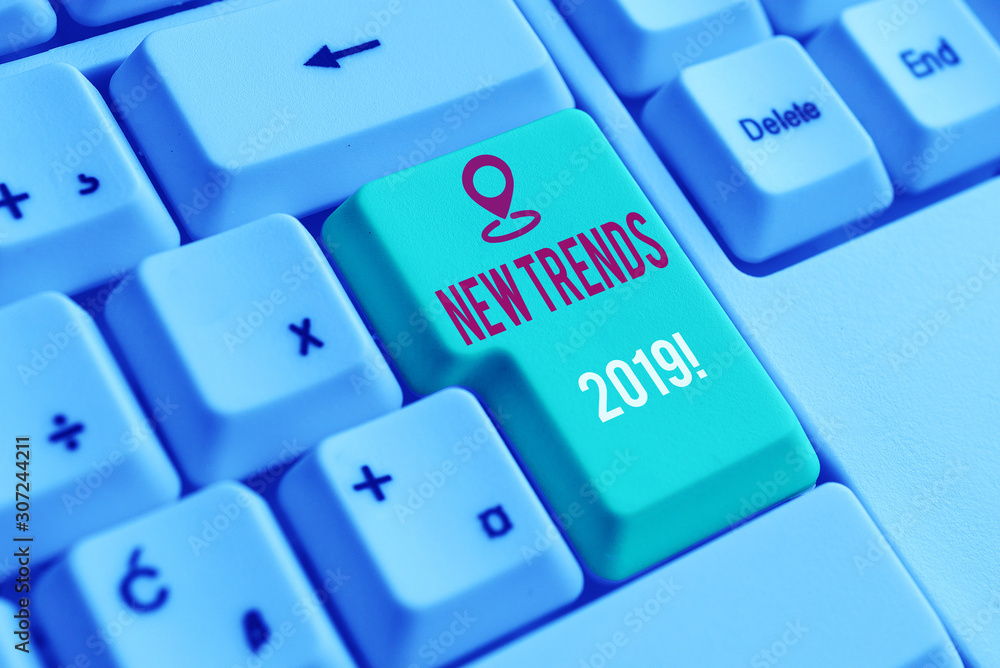 Text sign showing New Trends 2019. Business photo showcasing general direction in which something is developing White pc keyboard with empty note paper above white background key copy space Text sign showing New Trends 2019. Business photo showcasing general direction in which something is developing White pc keyboard with empty note paper above white background key copy space