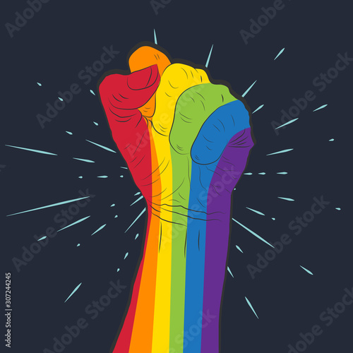 Rainbow colored hand with a fist raised up. Gay Pride. LGBT concept.