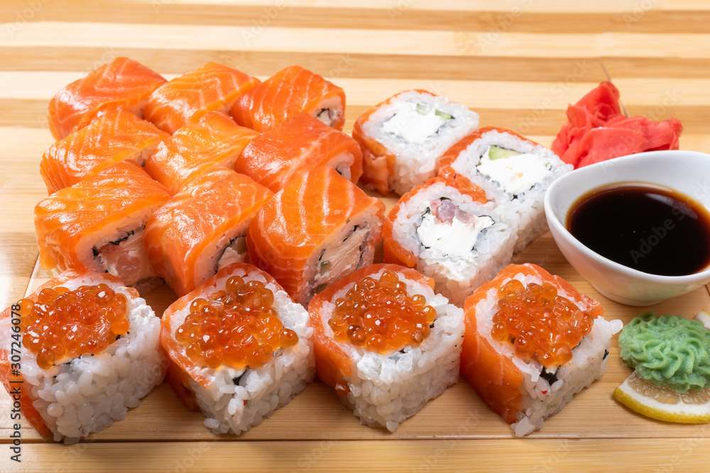 Sushi set with salmon. Philadelphia., with caviar. With ginger and wasabi. Close-up.