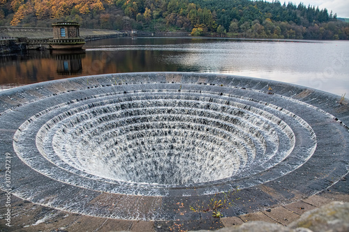 Large plughole at the Ladybower reservoir in overflow