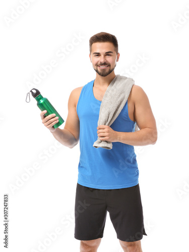 Sporty young man with towel...