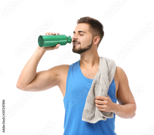 Sporty young man with towel...