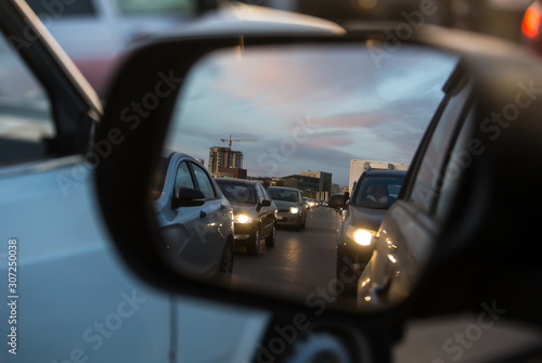 Car traffic in a car mirror