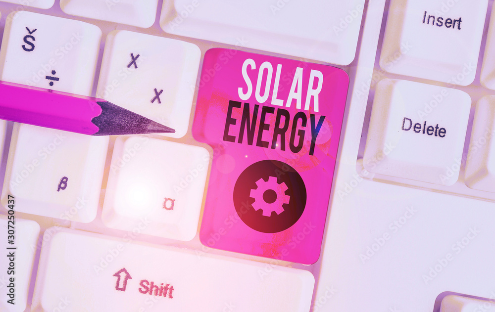 Handwriting text Solar Energy. Conceptual photo radiation from the Sun capable of producing heat or electricity White pc keyboard with empty note paper above white background key copy space Handwriting text Solar Energy. Conceptual photo radiation from the Sun capable of producing heat or electricity White pc keyboard with empty note paper above white background key copy space