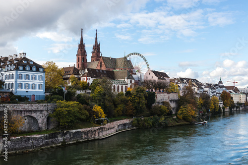 Look at boardwalk in Basel over the Rhine river - city near Switzerland, Germany and France, included cathedrals two towers and russian wheel © Ondej