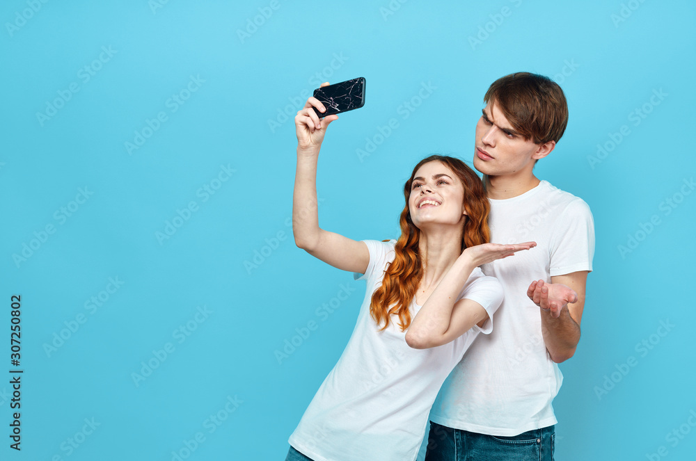 cheerful young couple in t-shirts cheerful young couple in t-shirts