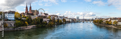 Panorama look at boardwalk in Basel - city near Switzerland, Germany and France, included cathedrals two towers and russian wheel